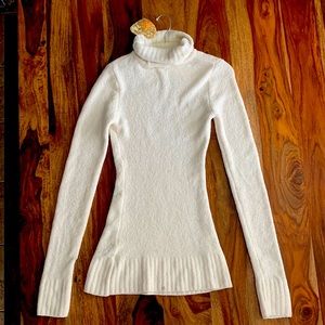 Medium sized, VERY soft, ivory, turtle neck sweater. Brand new with tags.